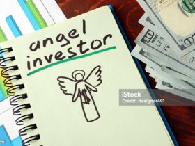 Notebook With Angel Investor Sign. Business Concept.