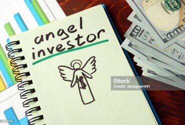 Notebook With Angel Investor Sign. Business Concept.